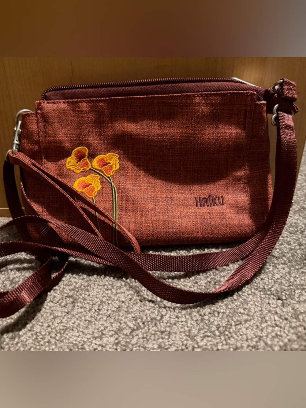 Haiku Stride Wristlet / Crossbody in Rust with Yellow Floral Embroidery